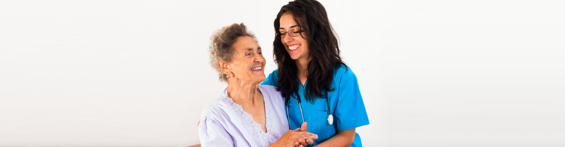 nurse and senior woman laughing